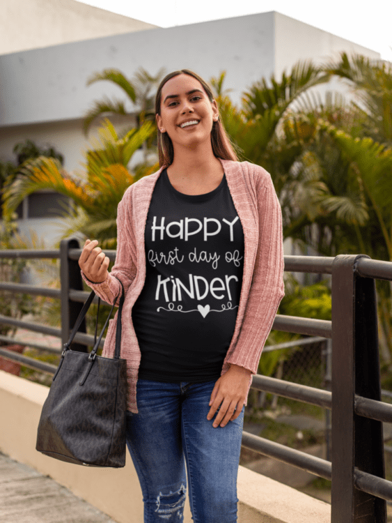 First Day of Kindergarten teacher tee on model with sweater