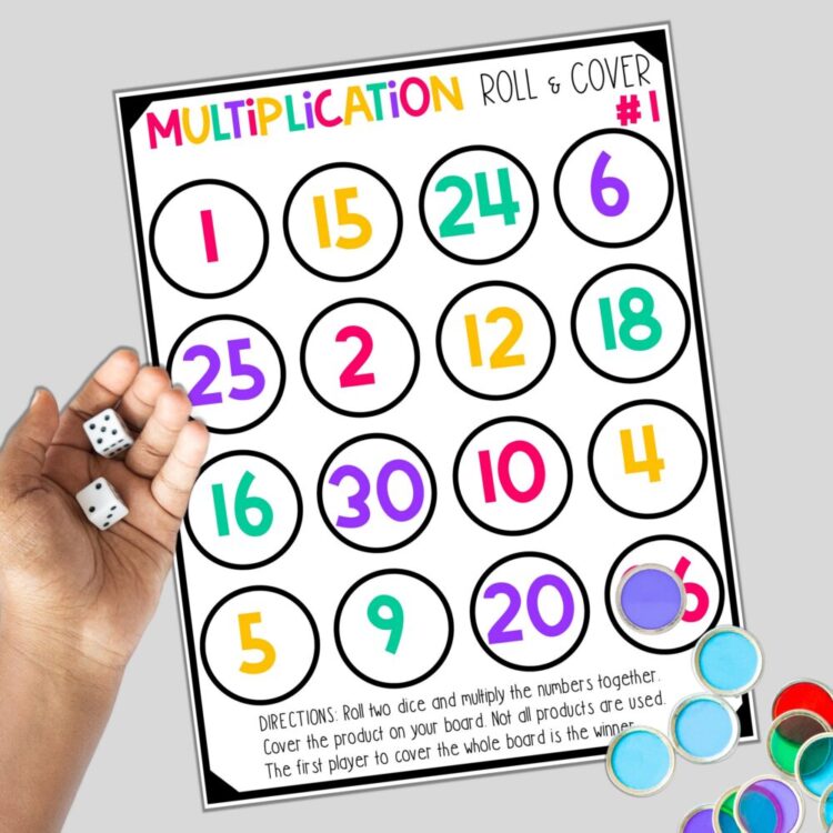 Multiplication Roll & Cover game with child rolling dice and bingo chips as game pieces