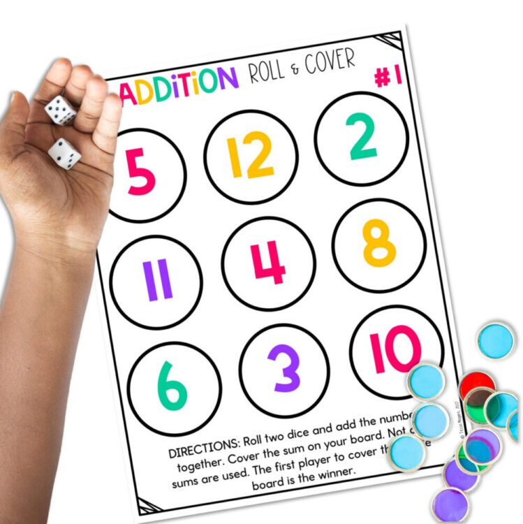 Addition Facts Roll & Cover game with students hand rolling two dice
