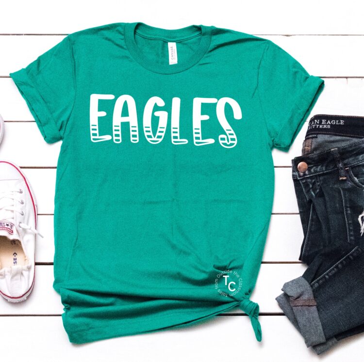 Eagles text displayed on kelly green tee