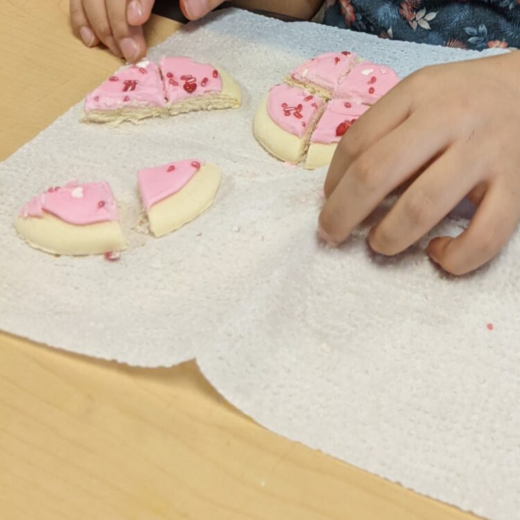 2 soft cookies cut into fourths to practice fractions greater than 1