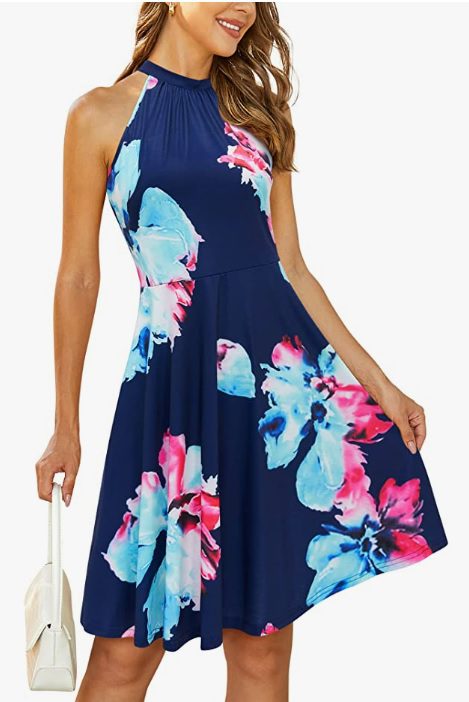 Navy blue summer sundress with pink and blue flowers. Dress has a halter neck and is knee length. This is a great dress for special summer events.